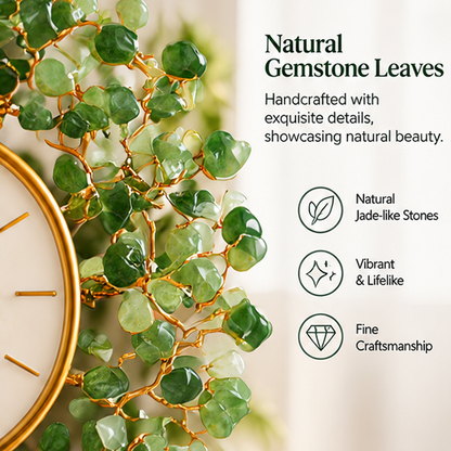 Close-up of green jade-like leaf stones and gold-tone branches surrounding the white clock dial