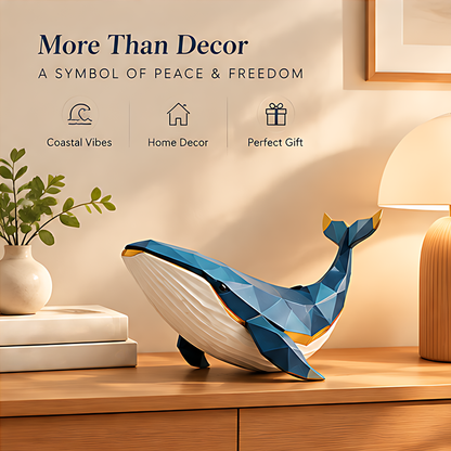 Whale sculpture displayed beside a lamp and greenery with text describing coastal decor, gifting and peace and freedom symbolism