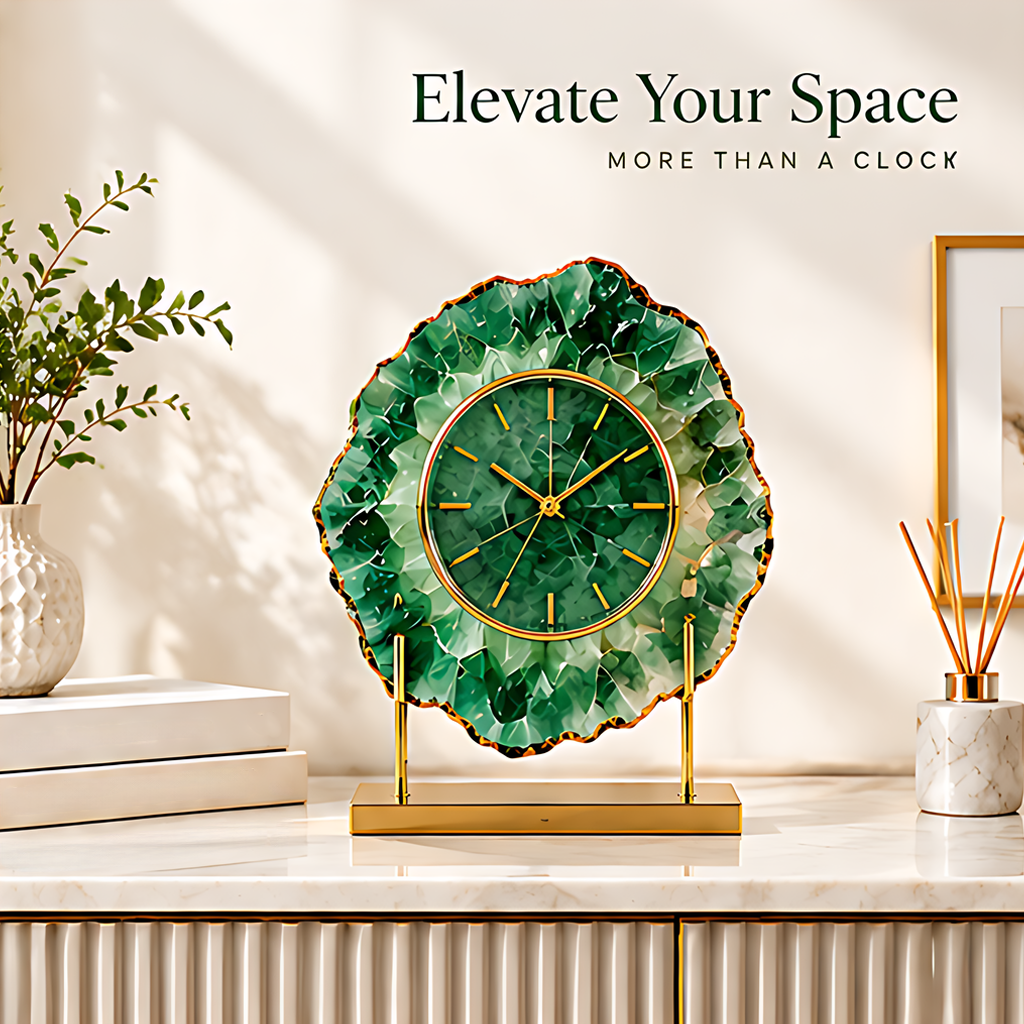 Green decorative clock styled on a console beside books, greenery and a reed diffuser